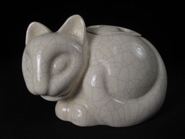 An unusual pottery cat flower holder