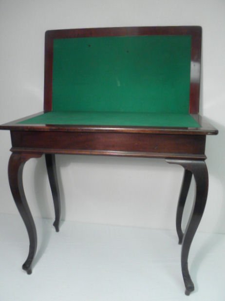 Mahogany flip top game table with a