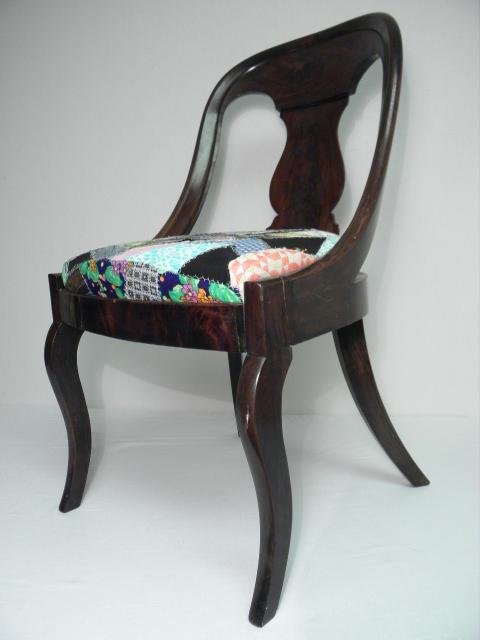 Carved Rosewood side chair with a rounded