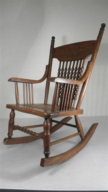 Childs antique oak rocking chair. Cane