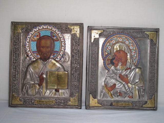 Two Russian painted icons. Silver