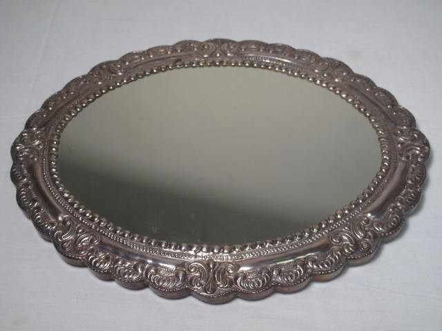 An oval mirrored plateau with sterling