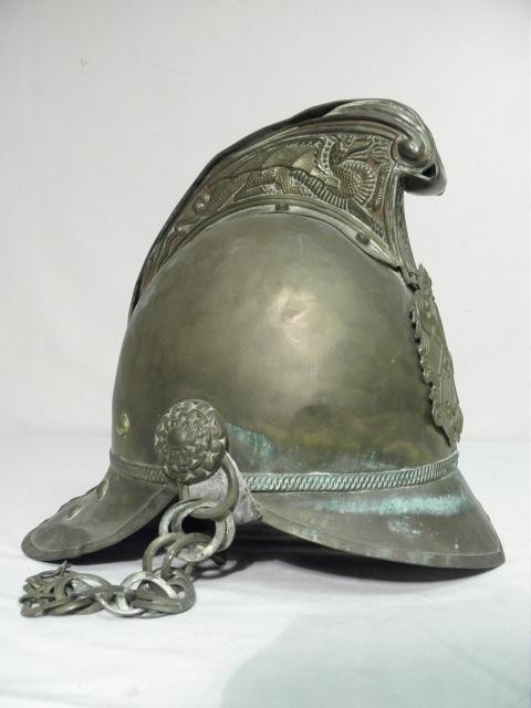 Early brass fire brigade helmet.