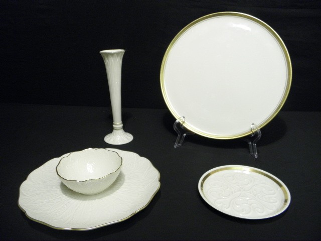 Four pieces of Lenox fine china.