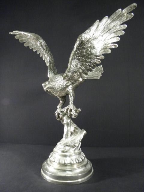 Large metal sculpture of a perched eagle