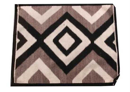 THREE NAVAJO RUGS.