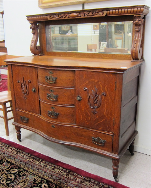 LATE VICTORIAN CARVED OAK SIDEBOARD