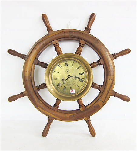 SHIPS WHEEL AND ATTACHED SHIPS CLOCK.