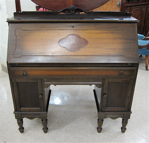 SLANT-FRONT DOUBLE PEDESTAL MAHOGANY