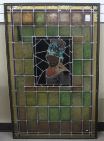 A STAINED AND LEADED GLASS WINDOW PANEL