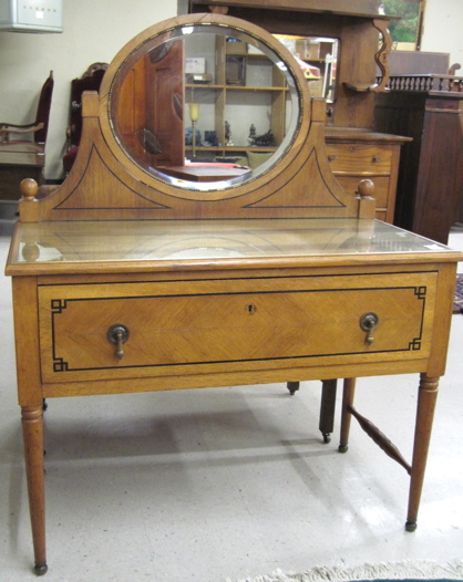 AN INLAID OAK DRESSING TABLE Continental