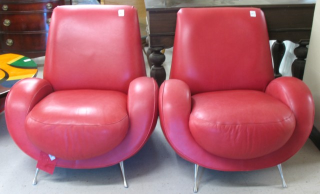 A PAIR OF ROSE LEATHER RETRO ARMCHAIRS