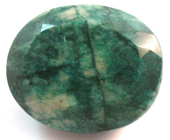 LARGE UNSET EMERALD WITH APPRAISAL.
