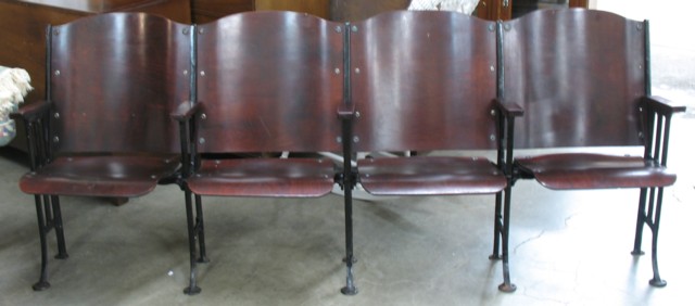 A ROW OF FOUR THEATER SEATS American