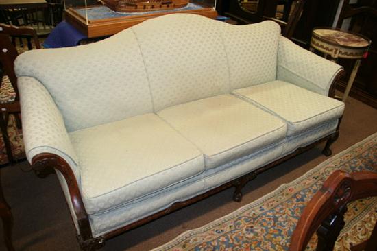 CAMEL BACK SOFA WITH CARVED ARMS AND