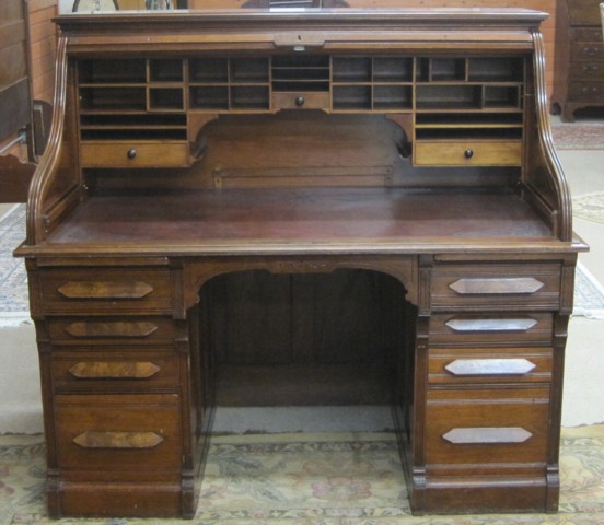 A VICTORIAN WALNUT ROLL-TOP DESK