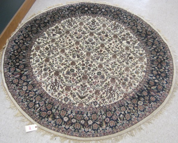 A ROUND ORIENTAL AREA RUG Indo-Persian