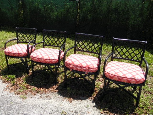 Four black rattan armchairs with