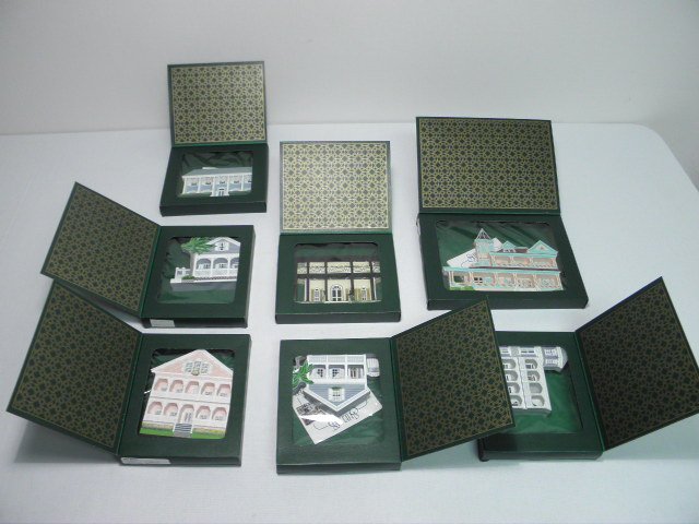 Seven Shelias collectable wood houses.