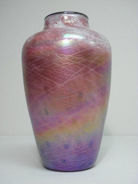 A pink iridescent cased art glass vase