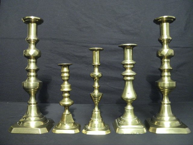 Five early brass candlesticks  16bcd4