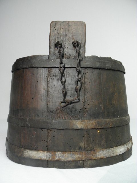 A primitive wood liquid cask with iron