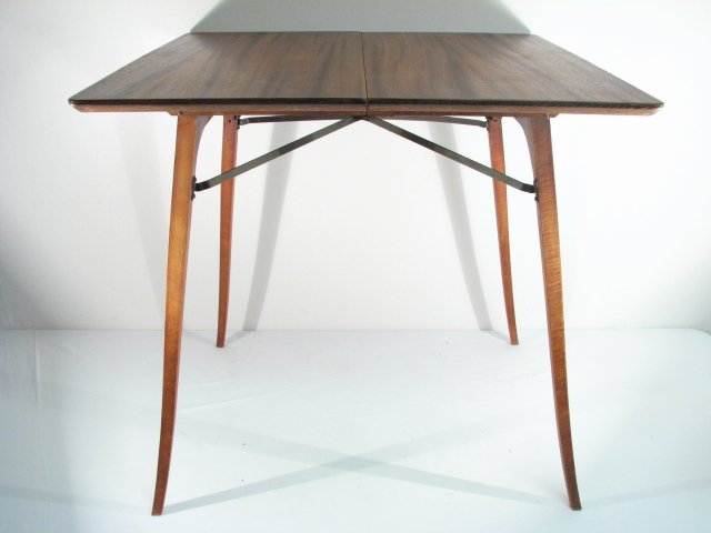 A wooden folding side/card table with