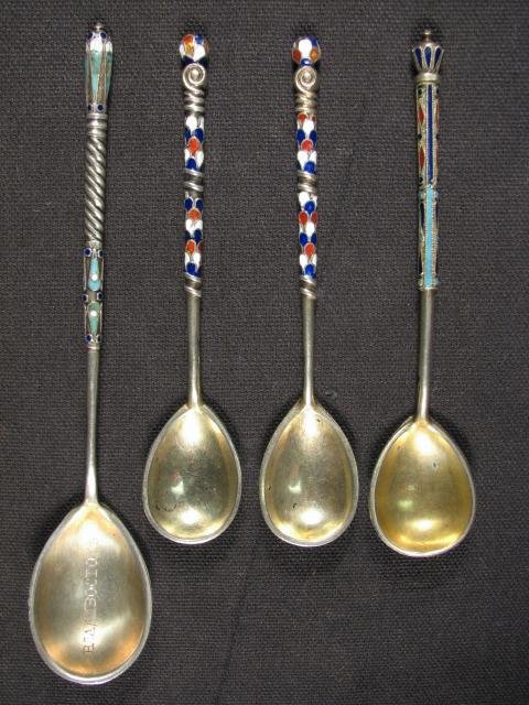 Four Russian enameled silver spoons.