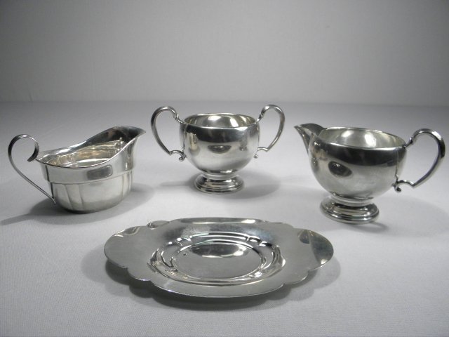 Four pieces of American sterling silver.