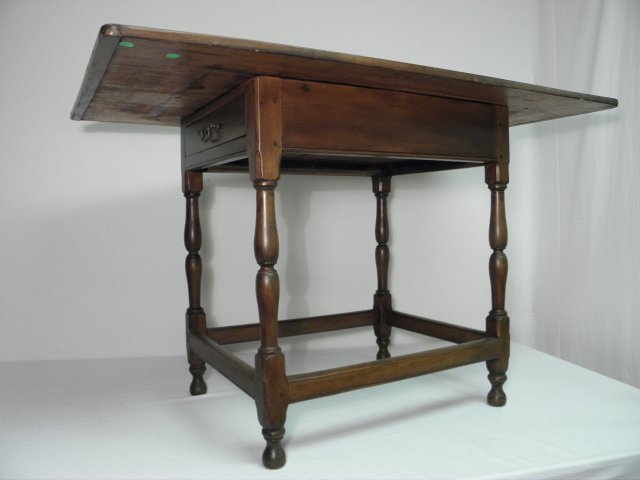 A one-drawer wide worktable with a Mahogany