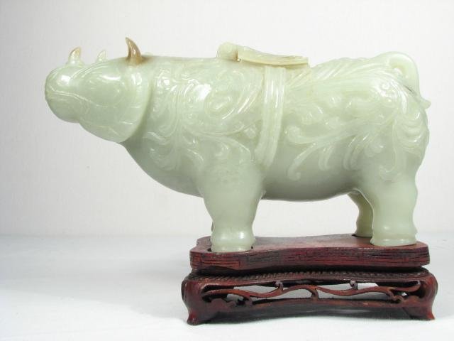 A Chinese carved green jade rhinoceros 16c126