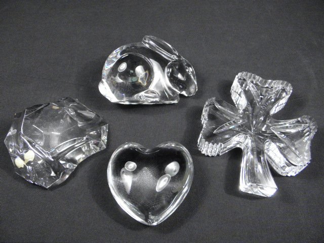 Lot of four assorted crystal paperweights.