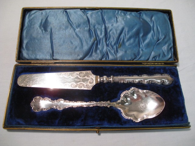 Elaborate spoon and cake server. Both