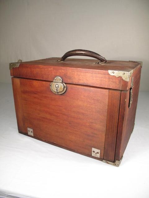 Wooden velvet lined dentists tool box.