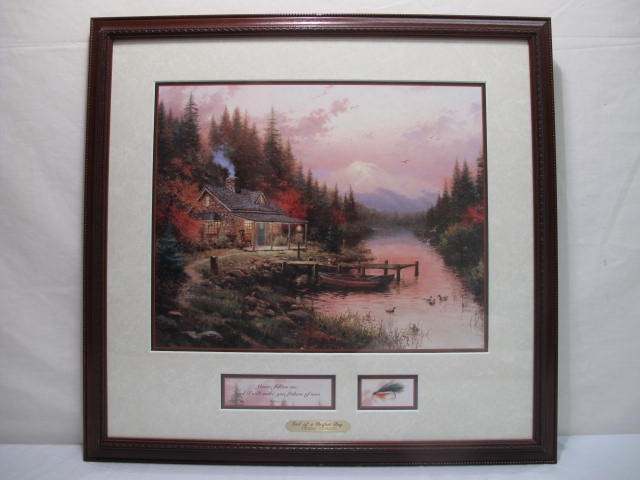 Thomas Kinkade framed print display.