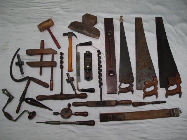 Box lot of assorted antique tools. Includes