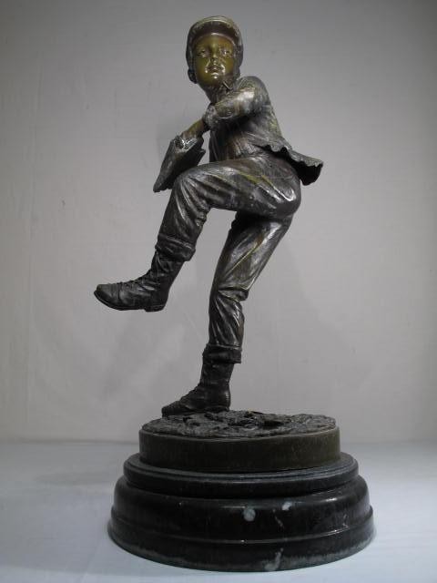 20th century sculpture of a young boy