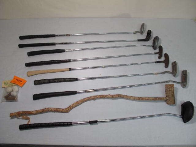 Lot of nine assorted golf clubs. Includes