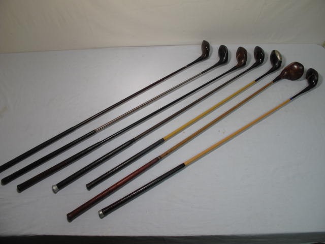 Assorted metal shafted golf clubs.