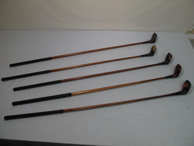 Fancy face wood shaft golf clubs.