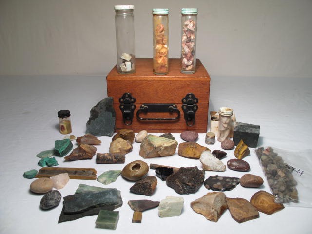 Box lot of assorted stone specimens.