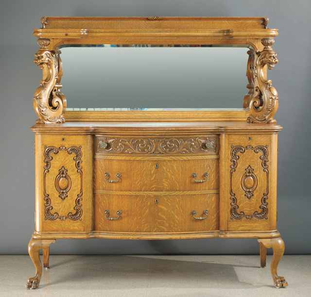 LATE VICTORIAN CARVED OAK SIDEBOARD