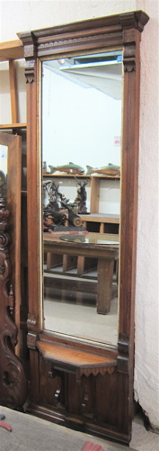 A VICTORIAN WALNUT-FRAMED PIER MIRROR