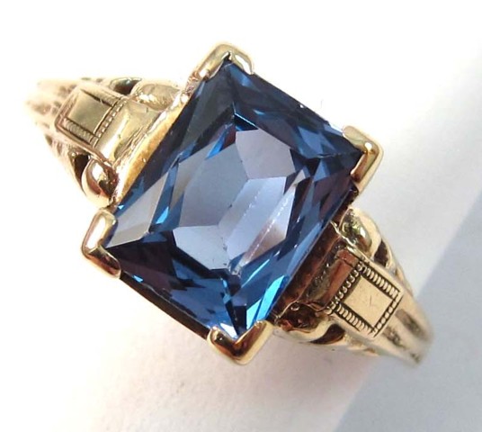 SYNTHETIC BLUE SPINEL AND TEN KARAT