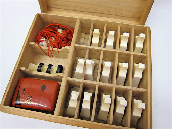 CASED SET OF FOURTEEN BRIDGES AND STRINGS