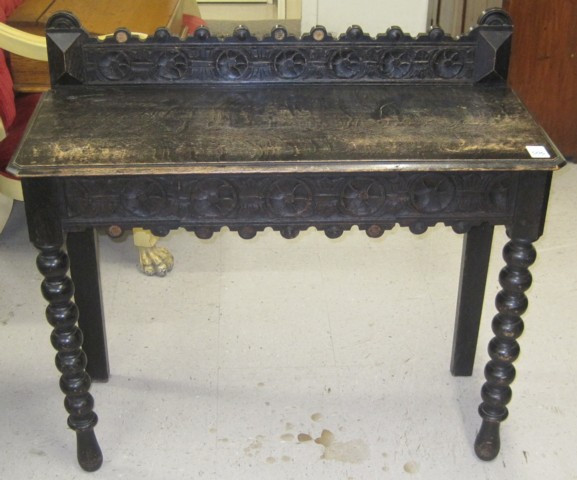 A VICTORIAN CARVED OAK PIER TABLE