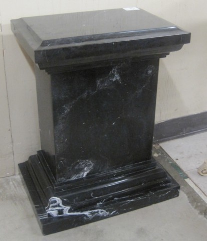 A BLACK MARQUINA MARBLE PEDESTAL