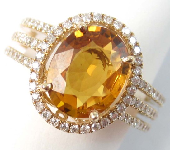 ORANGE SAPPHIRE AND DIAMOND RING