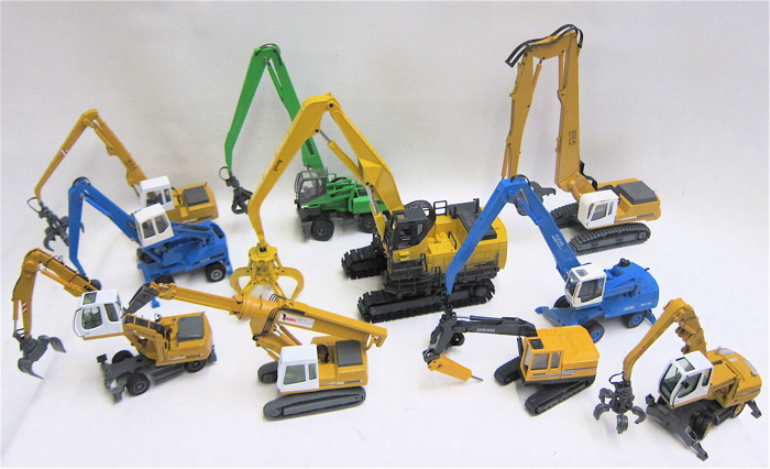 TEN DIECAST SCALE MODELS OF HEAVY EQUIPMENT