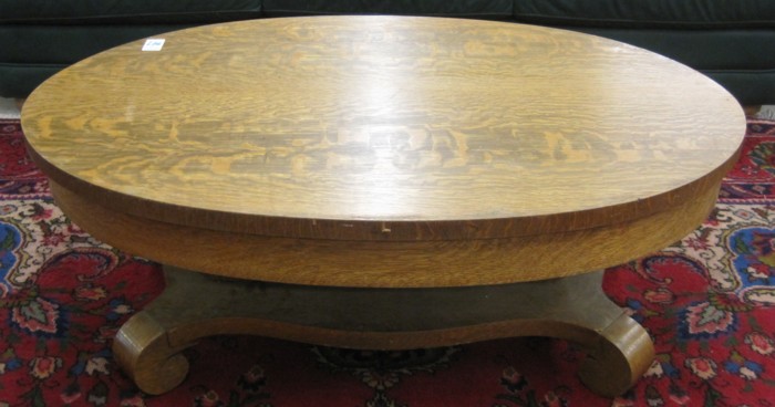 AN OVAL OAK COFFEE TABLE Empire Revival